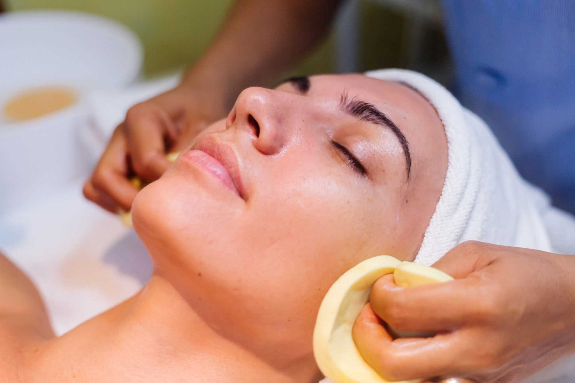 Woman undergoing facial treatment